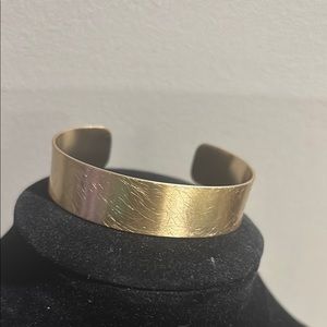 Gold tone cuff bracelet sketched